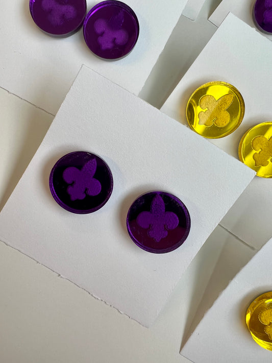 Fleur-de-lis mirror studs. Purple.